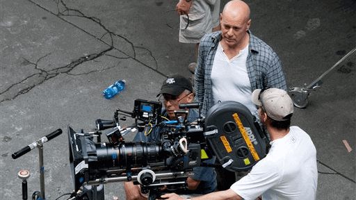Bruce Willis during a break from shooting on ‘A Good Day to Die Hard’ in Budapest. (Credit: AP /MTI, Bea Kallos)